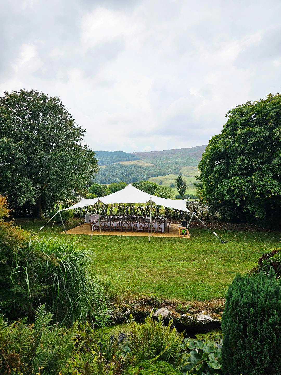 A small stretch tent on a lawn
